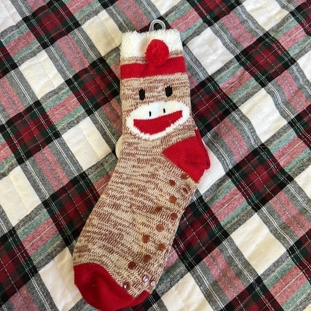 The sock monkey has rubber on the bottom for slip resistant.-Copy